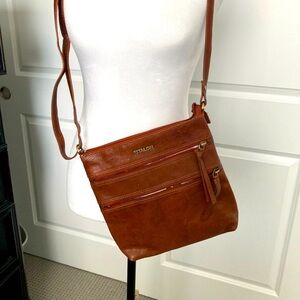 Crossbody shoulder bag. Faux leather. Looks and feels like real leather. Zippers